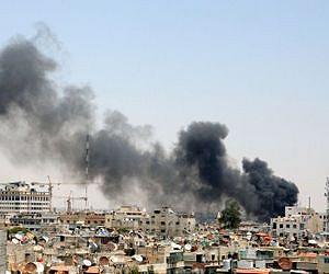 Air strike 'kills 60' as peace envoy Brahimi in Syria