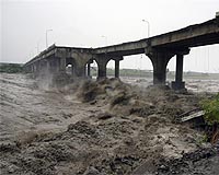Typhoons Trigger Slow Earthquakes