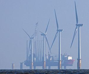 Britain to back EU emissions quotas, oppose renewables targets