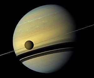 Saturn and its Largest Moon Reflect Their True Colors