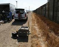 US Army unfurls miles of fencing along border with Mexico