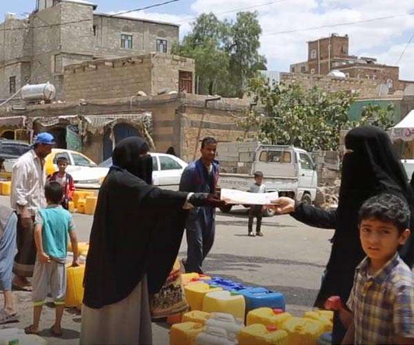 Children in war-scarred Yemen line up for water, not school