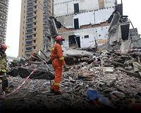 Father's last embrace saves girl in China building collapse