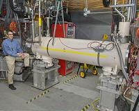 Beam-beam compensation scheme doubles proton-proton collision rates