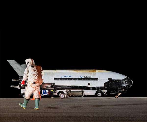 U.S. military space plane lands, ending record-breaking mission