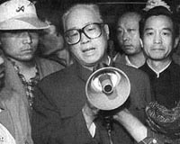 Chinese academic says beaten for trying to mourn late leader
