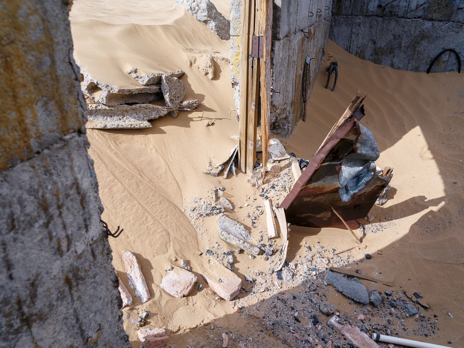 Saudi Arabia, a country that is roughly 95 percent desert, imports sand from Australia to make concrete, because wind-rounded desert grains are too smooth to bind and only angular river or quarry sand will hold a structure together