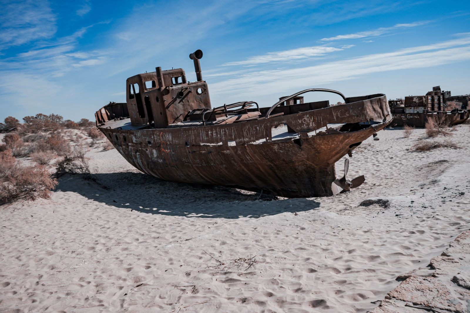 What happened when engineers built a single dam across the neck of a dying inland sea, and the northern lobe rose roughly four metres while fish returned to villages that had been stranded 100 kilometres from any shore?